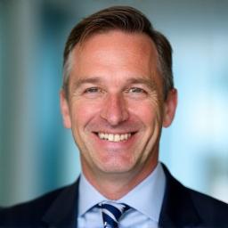 Professional headshot of Alan Briggs
